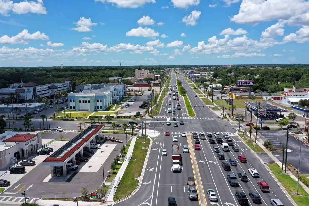 An example of a stroad: 5-6 car lanes in each direction with many turnings and junctions leading to highly spaced apart buildings with large car parks